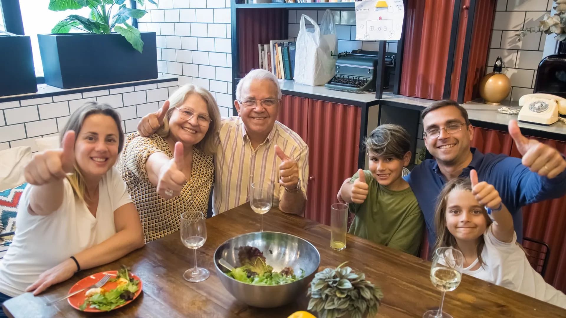 A happy family enjoying a meal together, showcasing togetherness and joy at a dining table.